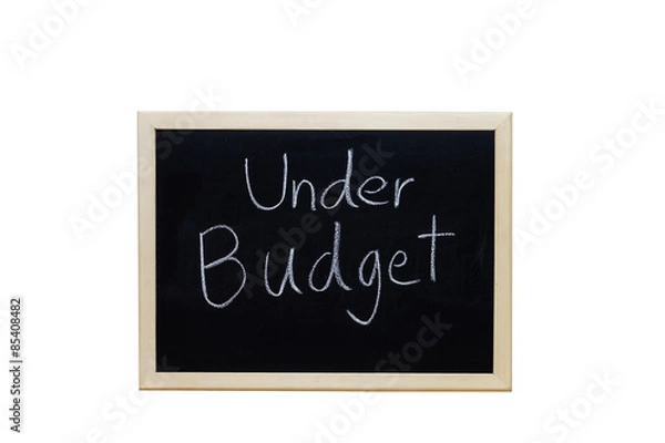 Fototapeta Under Budget written with white chalk on blackboard.