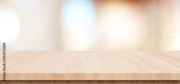 Fototapeta Table and blur background, Wooden counter over blur bokeh light background, Brown wood table top, shelf for food and retail shop, store product display backdrop, banner, mockup, template