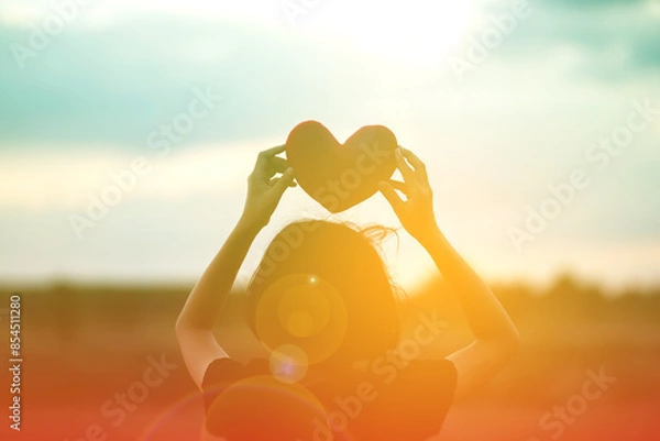 Fototapeta girl hands holding hearts silhouette