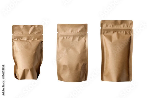 Fototapeta Three brown stand-up pouches with zippers, different sizes, isolated on white background.