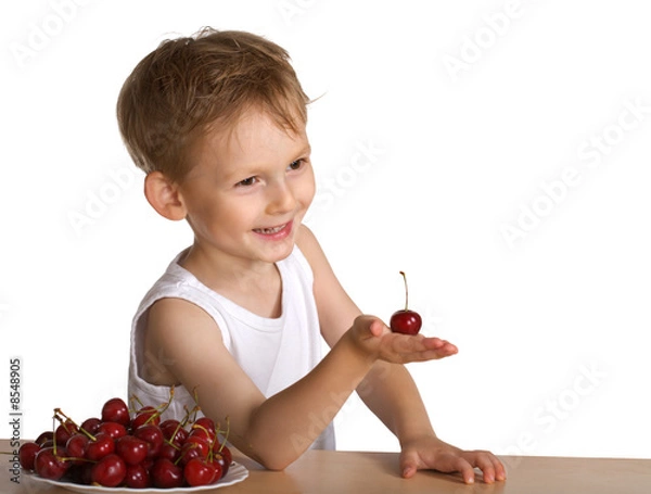 Obraz Little boy with a plate of a cherry