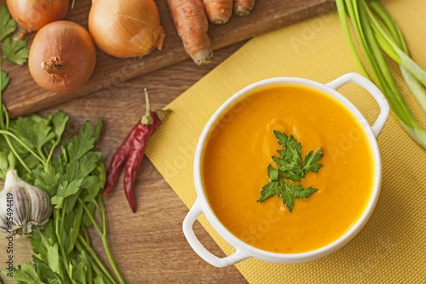 Obraz carrot soup with vegetables on wood table