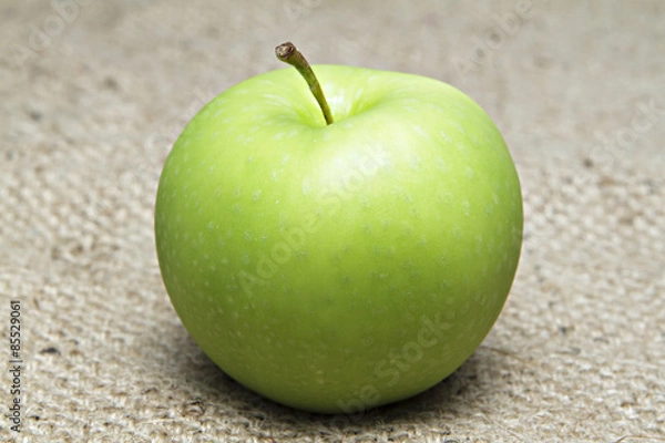 Fototapeta Green apple on sack.
