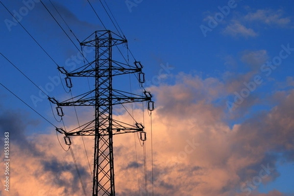 Fototapeta electricity infrastructure in the setting sunlight
