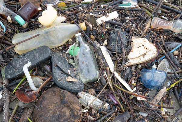 Obraz A sandy beach filled with human-made garbage
