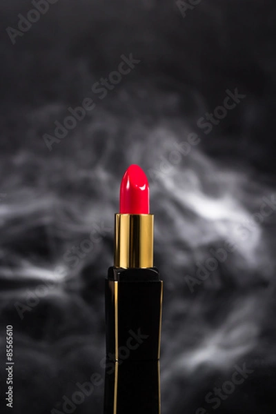Obraz Red lipstick isolated on black background