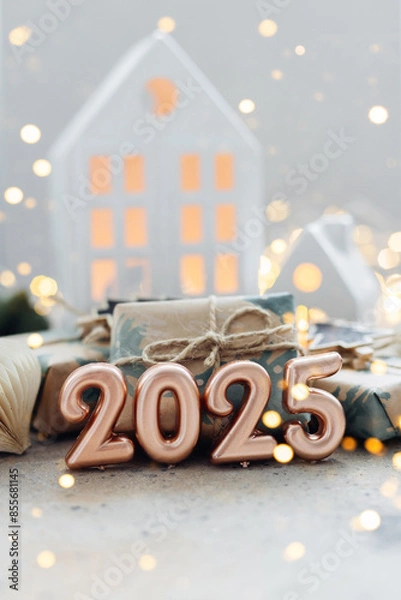 Fototapeta Christmas and New Year card. Number 2025 on holiday background. Christmas lights bokeh background. Holiday postcard. Happy New Year 2025 Card Concept.