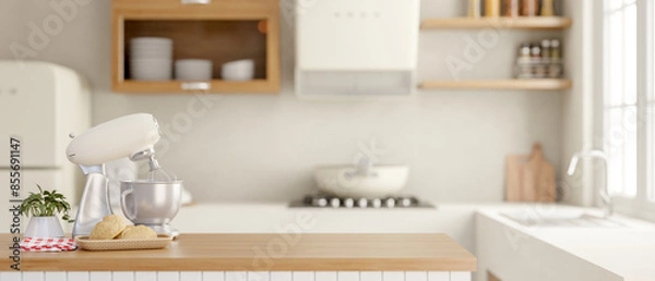 Fototapeta A dough kneading mixer blender on a wooden kitchen island in a contemporary minimalist kitchen.