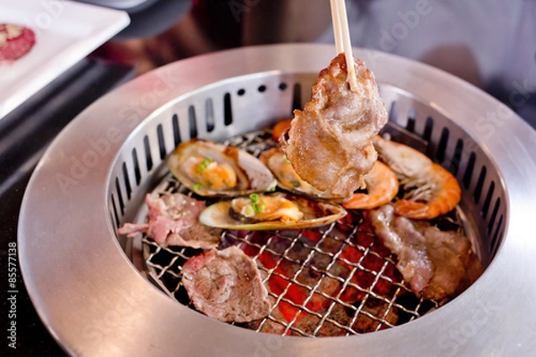 Obraz Mixed Roasted Meat and Seafood and Chopsticks on the BBQ Grill o