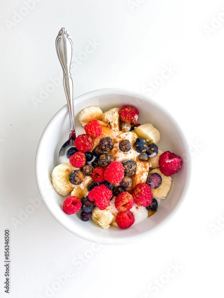 Fototapeta A morning breakfast yogurt bowl with berries and toppings