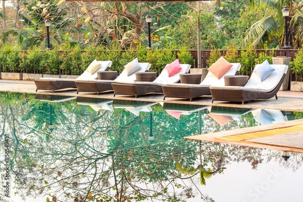 Fototapeta Colorful sunbed around the pool in Thailand