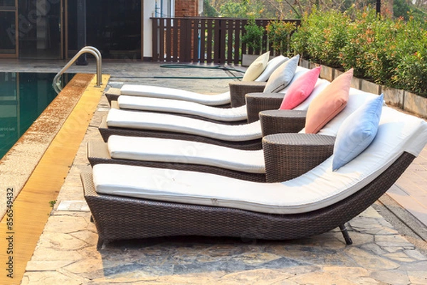 Fototapeta Colorful sunbed around the pool in Thailand