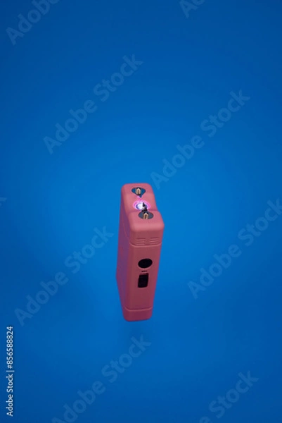 Obraz taser in blue background isolated