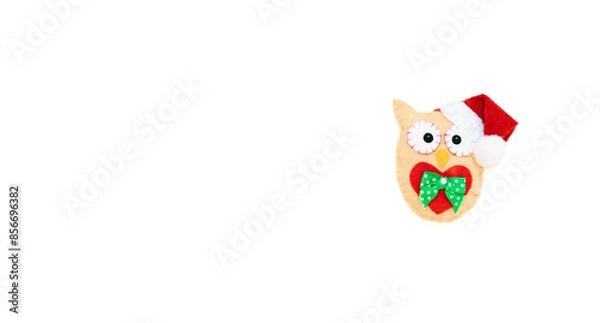 Obraz The toy owl is isolated on the white background with copy space. The atmosphere of Christmas and New Year. Christmas banner, mock-up