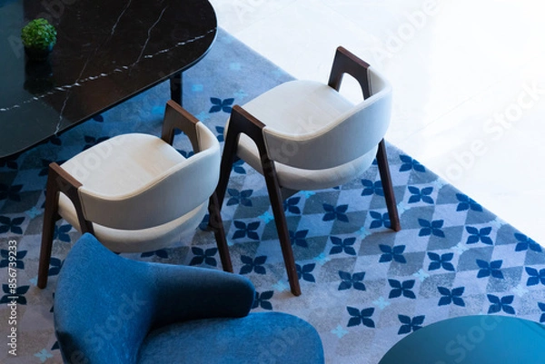 Fototapeta armchairs on carpet in cozy style