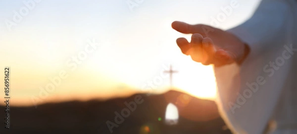 Obraz Hands of Jesus resurrected from the tomb and bright light background, heaven and cross love and salvation concept
