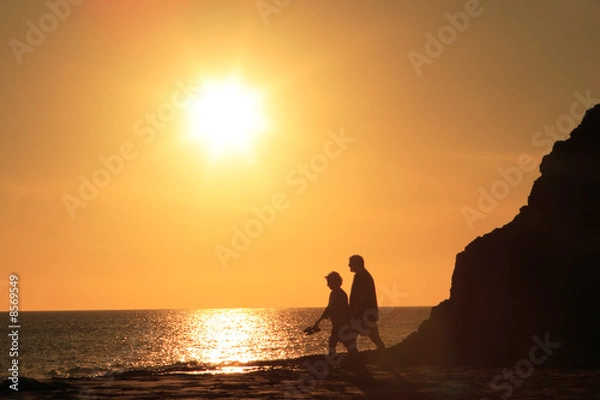 Obraz mature couple walking in sunset