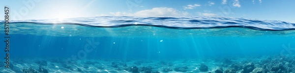 Fototapeta The ocean in section. The image shows a blue sky at the top and the sea cut along the bottom