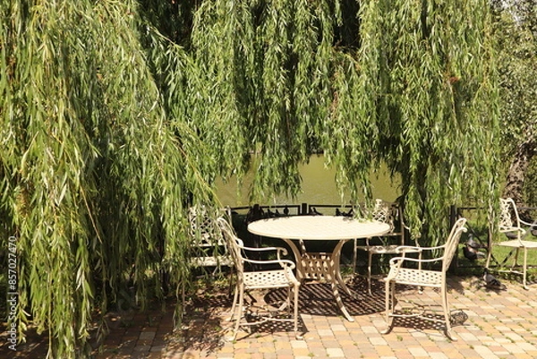 Fototapeta White table and chairs in the terace