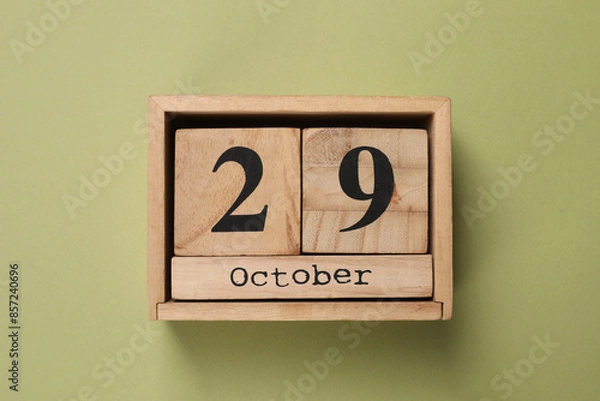 Fototapeta International Psoriasis Day - 29th of October. Block calendar on green background, top view
