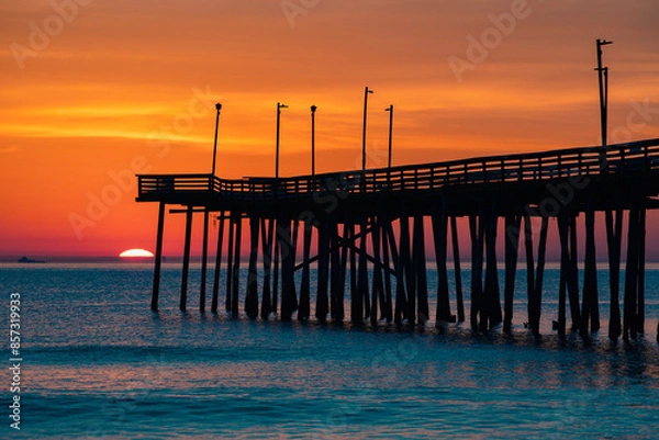 Obraz sunrise or sunset on the pier by the ocean