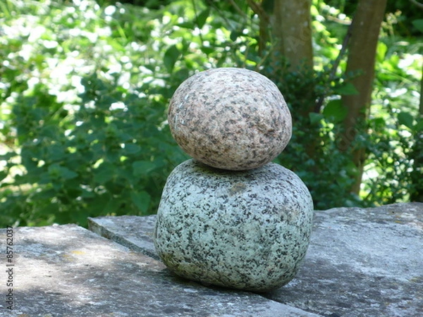 Fototapeta superimposed stones on a crack, in a garden