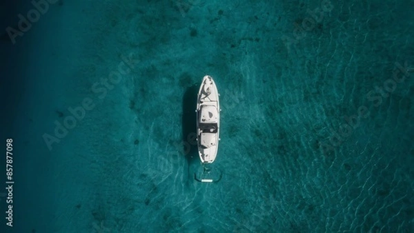 Obraz Top view of a blue ocean with a boat