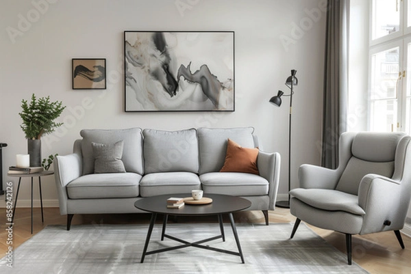 Fototapeta photo of grey sofa and recliner chair with plants in a scandinavian clean and minimalist living room apartment and design interior furniture