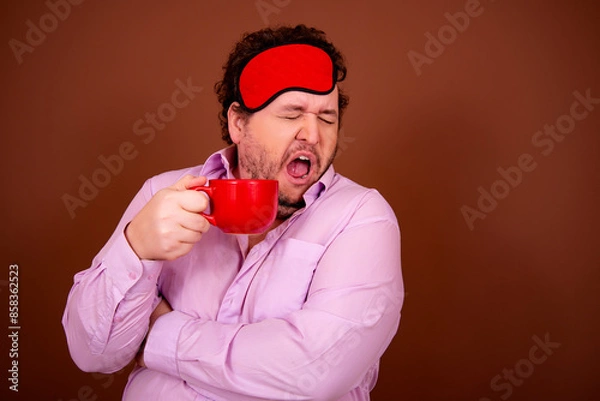 Obraz Early morning fresh gossip. Funny fat man drinking coffee. Brown background.