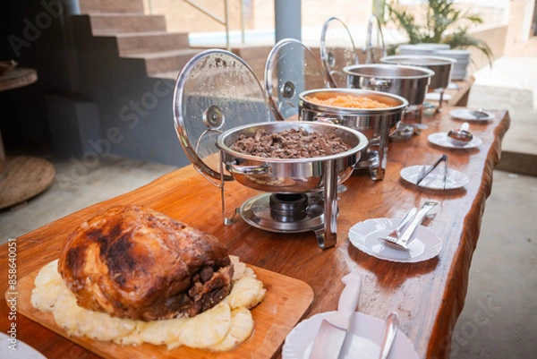 Fototapeta Roasted Fresh Ham served with pineapples.