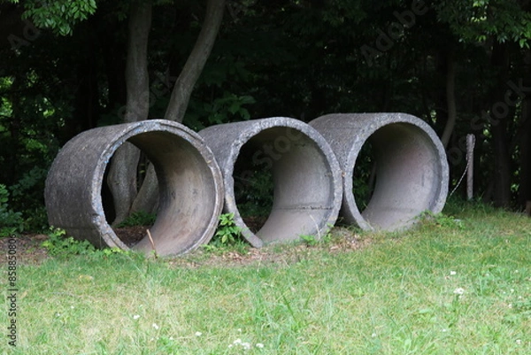 Fototapeta Three concrete cylindrical objects