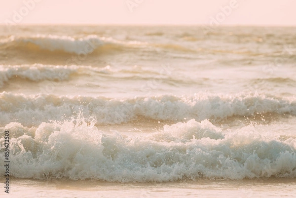 Fototapeta View sea ocean water surface with foaming small waves at sunset. Amazing landscape scenery. Ocean water foam splashes washing sandy beach. Beautiful background. Nature background