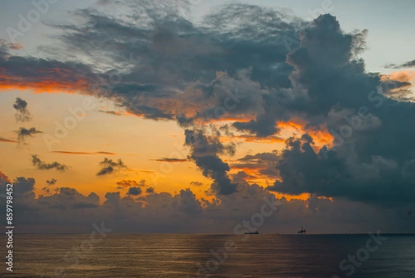 Fototapeta Calm weather on sea or ocean with beautiful cloud scene and offshore drilling rig and tanker ship
