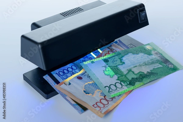 Fototapeta Security features on banknote in UV light protection