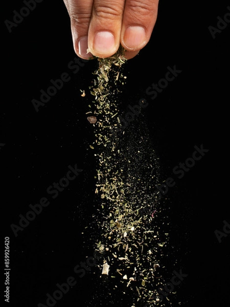 Obraz Spices are sprinkled on a dark background