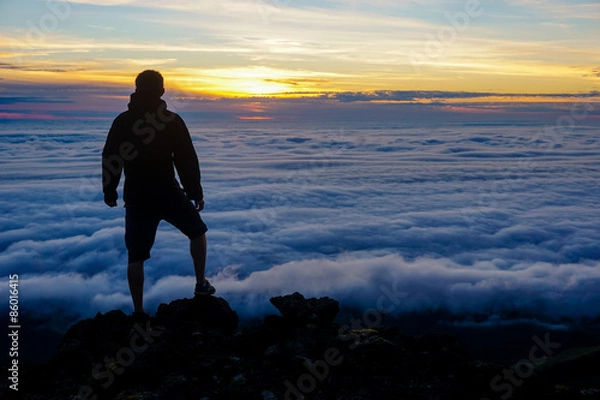 Obraz Watching the sunset above the clouds
