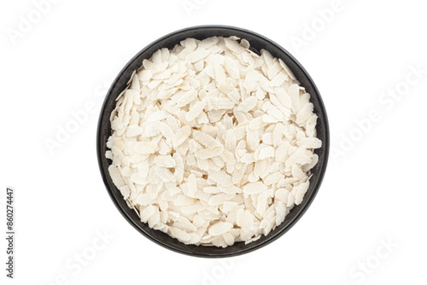 Obraz Organic Flattened Rice (Oryza Sativa) or Poha, in a black ceramic bowl. Isolated on a white background. Top View