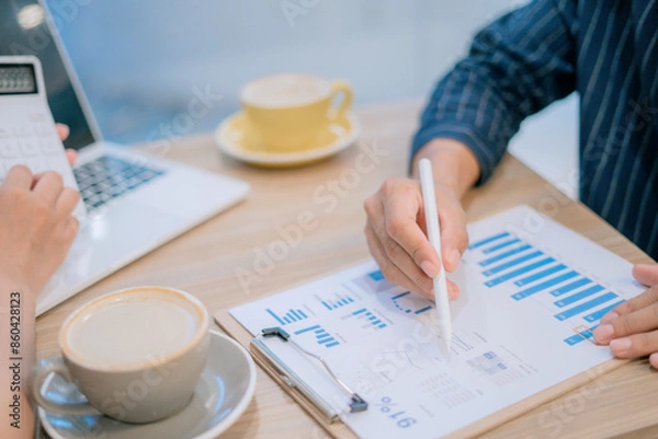 Obraz Close-up image of man and woman calculating business