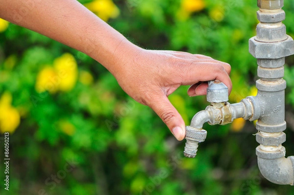 Obraz turn off water with green  leaf  background