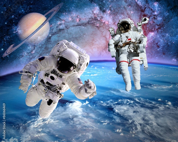 Fototapeta Astronaut spaceman outer space saturn planet earth universe. Elements of this image furnished by NASA.