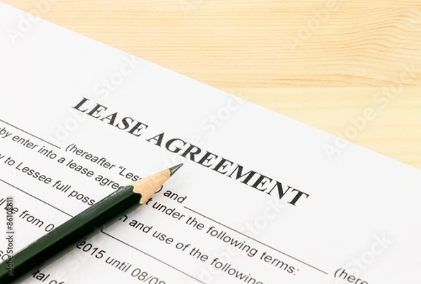 Fototapeta Lease Agreement Contract Document and Pencil Bottom Left Corner