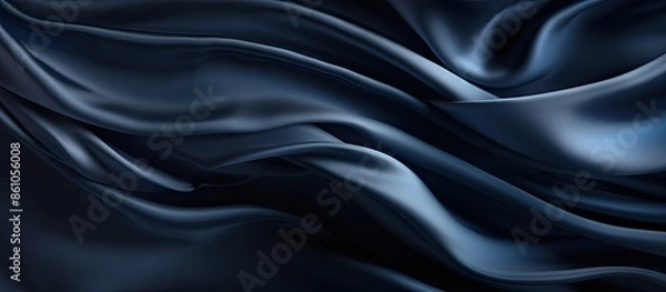 Fototapeta Navy blue silk satin texture background with beautiful soft wavy folds, creating a dark, elegant copy space image ideal for your design.