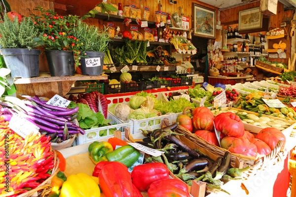 Fototapeta Different types of fresh vegetables, herbs in pots for sale at the Italian market in Venice, Italy