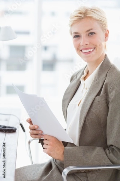 Obraz Smiling businesswoman looking at camera