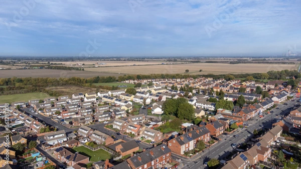 Fototapeta Aerial drone photo of the village of Moorends in the north-east of the Metropolitan Borough of Doncaster, South Yorkshire showing residential housing estates.