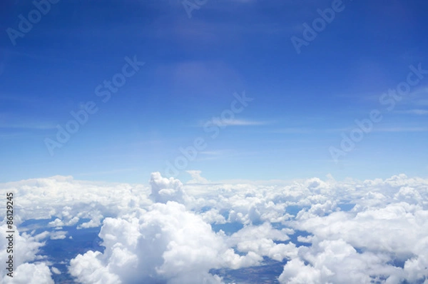 Fototapeta A view of sky, clouds photographed from an airplane.