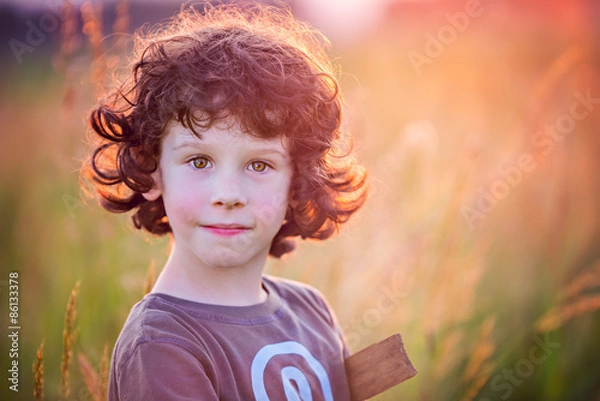 Fototapeta Summer warrior - playing on the filed in sunset