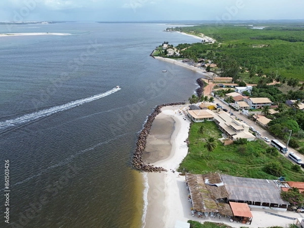 Obraz Aerial view of Praia do Saco, tourititc place near Aracaju city, Brazil. White sand beach, green vegetaion, constructions and sea water