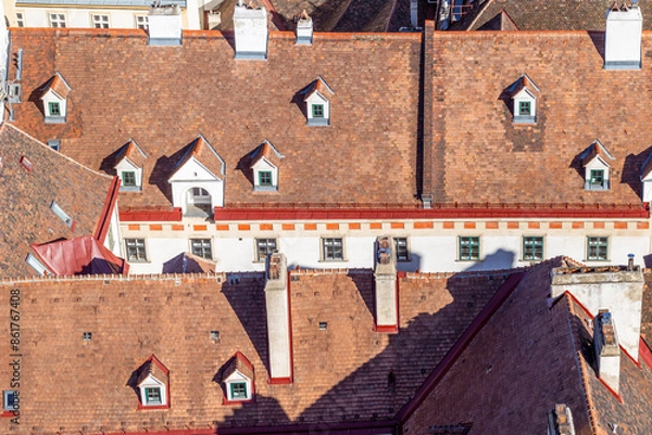 Fototapeta Old tiled roofs with dormer windows in Vienna