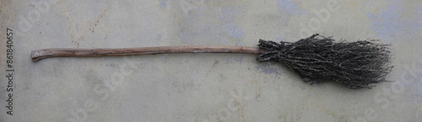 Obraz old broom on a dirty floor